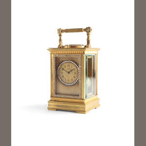 A early 20th century French paste and brass repeating carriage clock