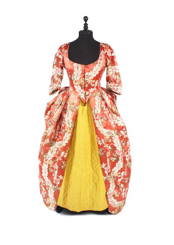 A 1770-80s silk brocade polonaise dress and a quilted silk petticoat
