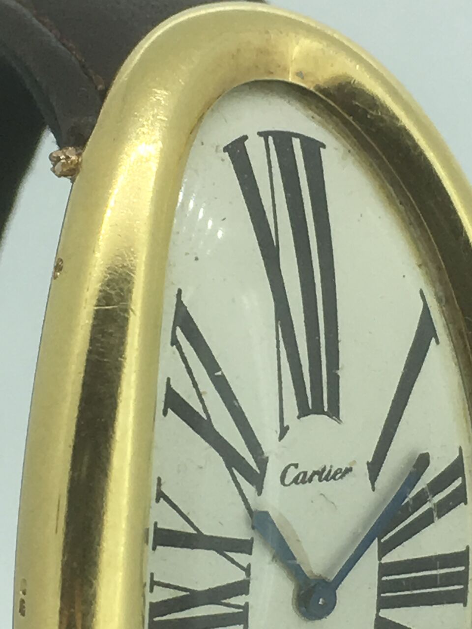 Bonhams Cartier. A rare oversized 18K gold manual wind oval