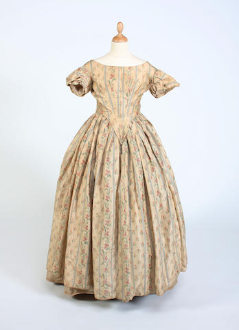 Bonhams : A mid-19th century dress of peach silk