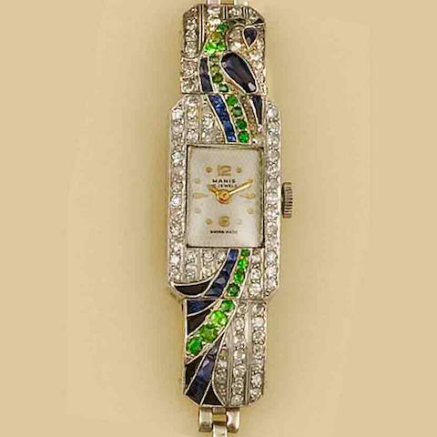 Bonhams : A diamond, sapphire and demantoid garnet cocktail watch