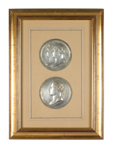 Bonhams : Framed Napoleon Medallions, a set of four frames containing  medallions relating to Emperor Napoleon. The first frame with single brass  medallion, the second containing eight white metal medallions depicting  varying