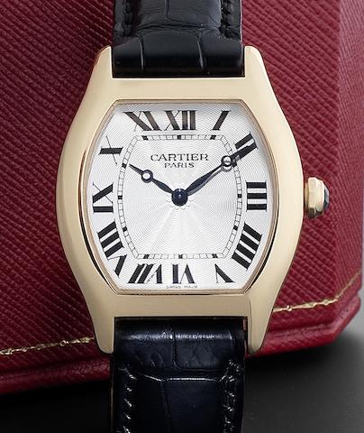 Bonhams : Cartier. An 18ct gold manual wind wristwatch together with ...
