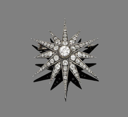 Bonhams : A diamond star brooch,