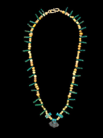 Bonhams : An Egyptian glass and glazed composition bead necklace