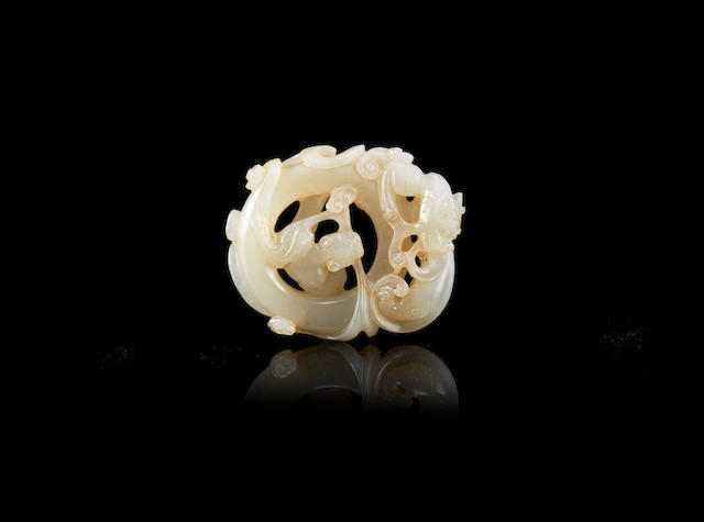 Bonhams : A white jade reticulated carving of chilong