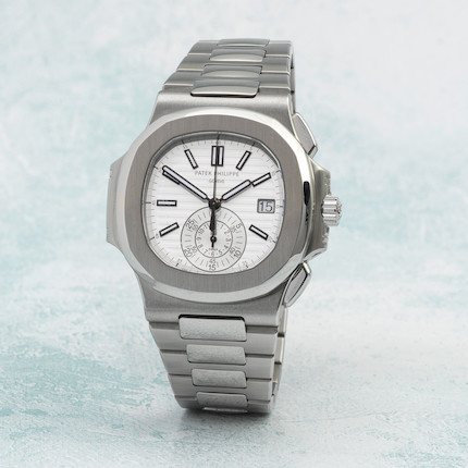 PATEK PHILIPPE. A VERY RARE AND FINE STAINLESS STEEL AUTOMATIC WRISTWATCH  WITH SWEEP CENTRE SECONDS, DATE AND BRACELET