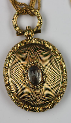 Bonhams : A Victorian gilt metal oval locket on chain