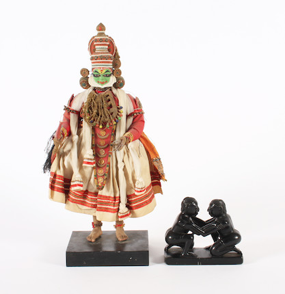 Bonhams : An Indian Kathakali figure and a black stone group of two ...