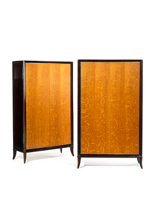 Pair of Cabinets attributed to Jean Pascaud circa 1940  oak with ebonised frame and brass trims, one with fitted interior, the upper section opening to mirrored glass panelling, the lower section with shelf, the second with three adjustable shelves, together with four keys   170 by 100 by 59 cm. 66 15/16 by 39 3/8 by 23 1/4 in. image 2