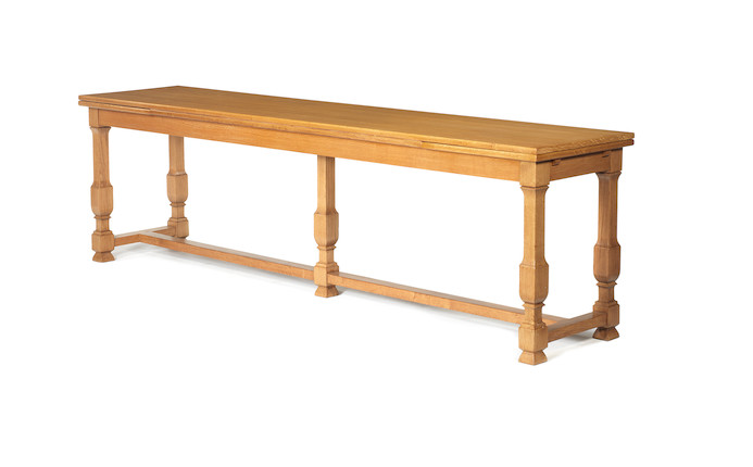 Extending Console Table French, circa 1940 in the style of J C Moreux  oak  74.5 by 275 by 54.5 cm. 29 5/16 by 108 1/4 by 21 7/16 in. Extended width 387 cm.                        152 3/8 in. image 1