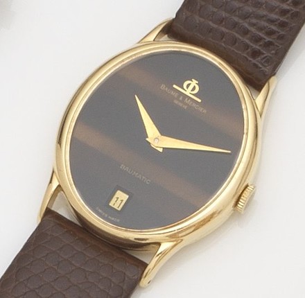 Bonhams : Baume & Mercier. An 18ct gold automatic wristwatchBaumatic ...