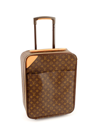 Bonhams : A small Louis Vuitton brown and tan monogram rolling suitcase