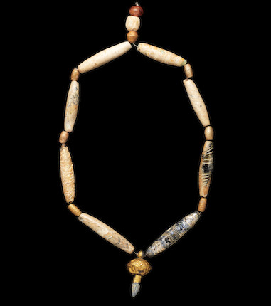 Bonhams : A Western Asiatic glass and gold bead necklace