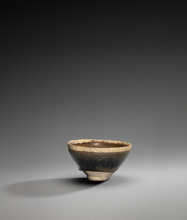 A superb and rare Ding persimmon-glazed conical bowl, Northern