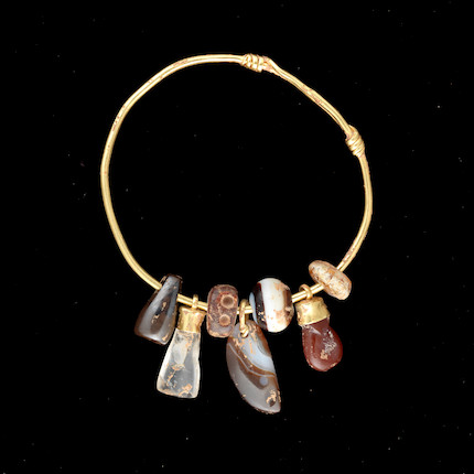 A Roman gold and hardstone amuletic bracelet image 1