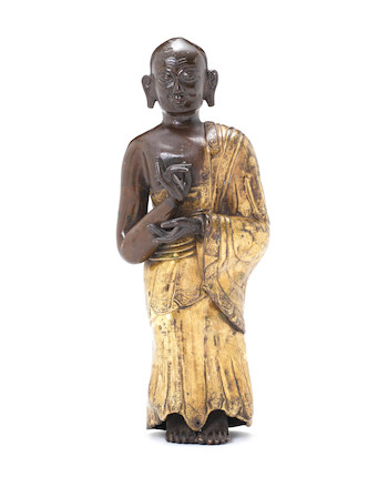 Bonhams : A parcel-gilt copper repoussé figure of a Buddhist monk 18th ...