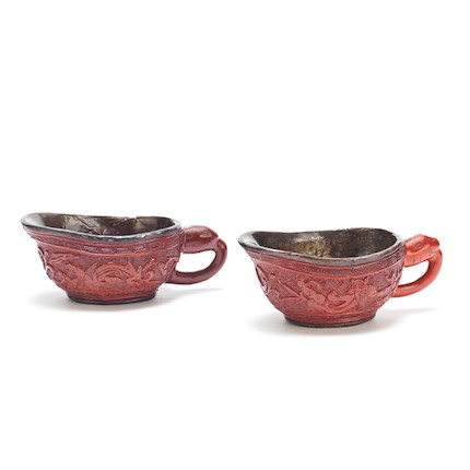 Bonhams : A PAIR OF CINNABAR LACQUER POURING VESSELS, YI 16th century (2)