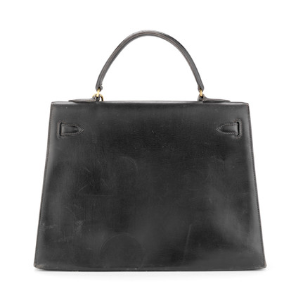 Bonhams : Black Box Leather Kelly 32, Hermès, c. 1964, (Includes key ...