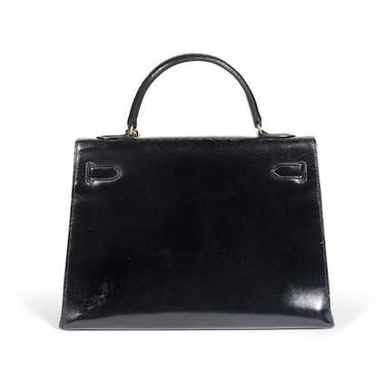 Bonhams : Black Box Kelly Sellier 32, Hermès, 1960s, (Includes padlock ...