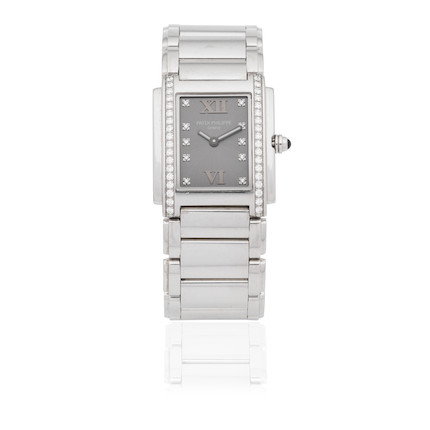 Bonhams : Patek Philippe. A lady's stainless steel and diamond set ...