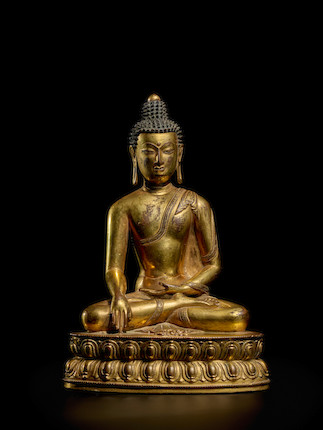 A GILT COPPER ALLOY FIGURE OF VAJRASANA BUDDHA TIBET, 14TH/15TH CENTURY image 1