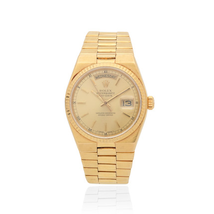 Bonhams : Rolex. An 18K gold quartz calendar bracelet watch ...