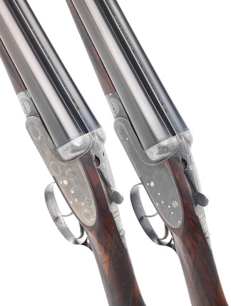 A fine matched pair of 12-bore sidelock ejector guns by Boss  no. 5426 & 5755 In a brass-mounted oak and leather case with canvas cover and makers trade-label In a brass-mounted oak and leather case with canvas cover and makers trade-label (3) image 1