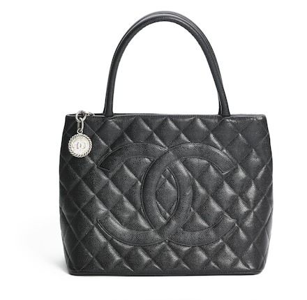 Bonhams : Chanel A Medallion bag of black quilted Caviar leather with  silver tone hardware, two handles and one exterior back pocket.