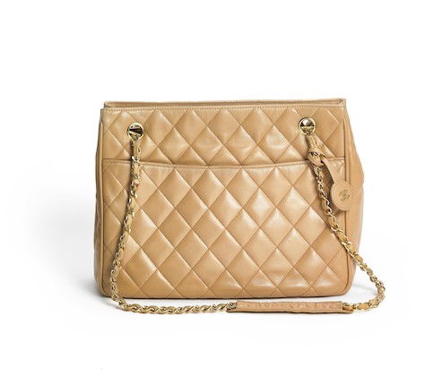 Bonhams : Chanel A vintage bag of beige quilted leather with gold tone  hardware, two chain straps and two exterior pockets.