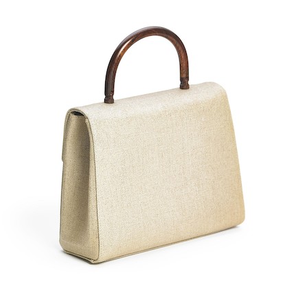 Bonhams : Chanel A Top Handle Flap Bag of beige coated canvas with gold  tone hardware, wooden top handle and wooden CC turn lock.