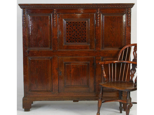An early 18th Century oak food cupboard,</r> 141 x 146 x 49cm