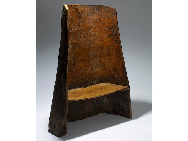 A rare 18th Century elm 'dug-out' chair or small settle, South West England,</r> 141 x 103cm.