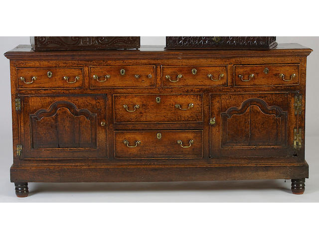 An 18th Century oak low dresser, 93 x 199 x 51cm.