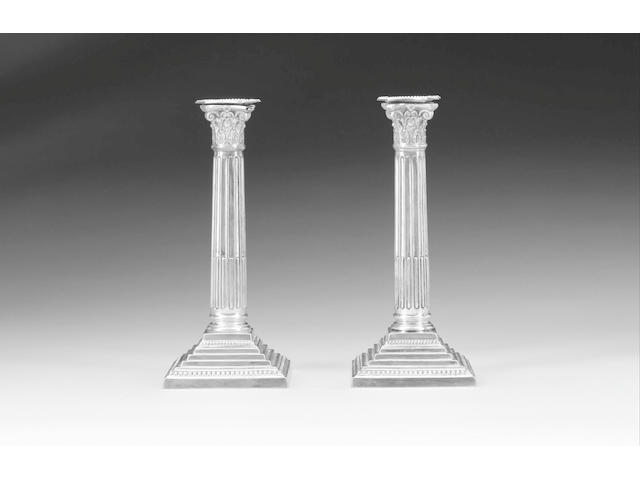 A pair of late Victorian silver Corinthian column candlesticks, by Ball Bros., Birmingham 1897,