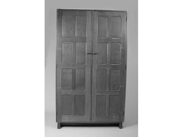 A Cotswold school oak double wardrobe,  102cm wide.