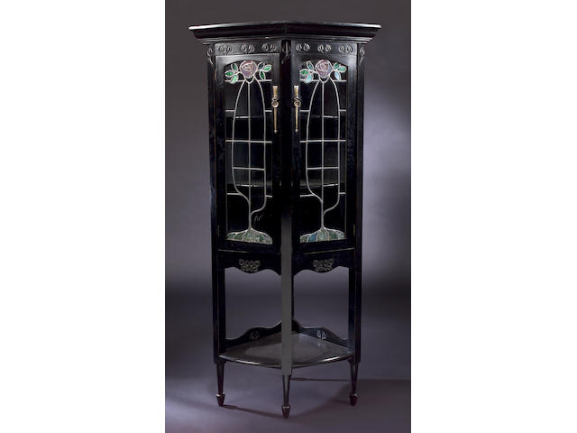 A Scottish ebonized corner cabinet, In the Glasgow Style, 88cm x 187.5cm x 62