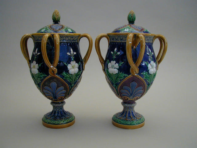 A pair of Minton Majolica vases and covers,  29cm high.(4)