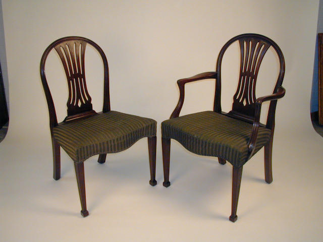 A set of twelve George III style mahogany dining chairs,