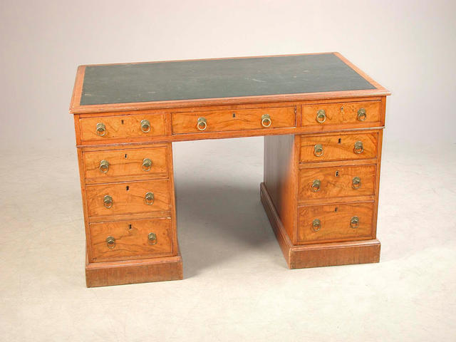 A 20th century walnut pedestal desk 120 cm. wide x 72 cm. deep x 74 cm. high