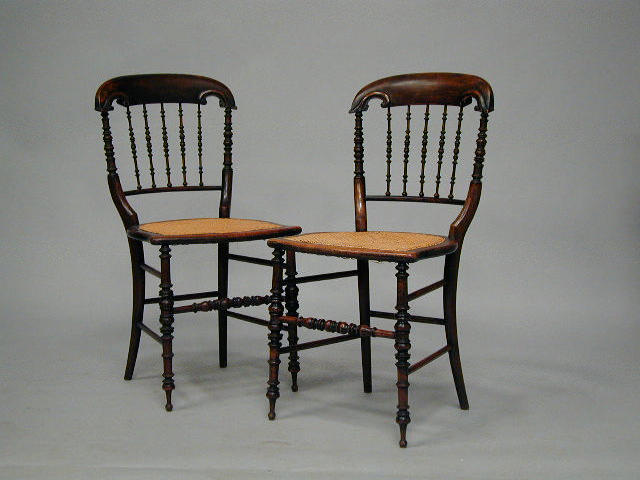 A set of six Victorian spindle back dining chairs,