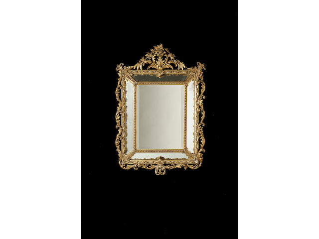 A Louis XVI style gilt composition cushion mirror, 133cm. high, 94cm. wide