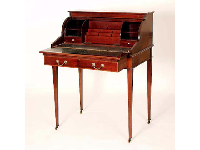 An Edwardian mahogany cylinder desk, Maple & Co, 76cm wide. See Illustration.