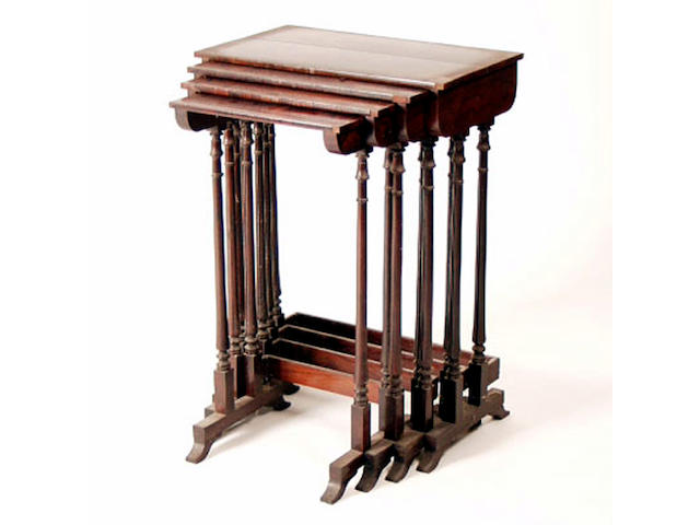 A nest of four rosewood quartetto tables, 51cm wide. See Illsutration.