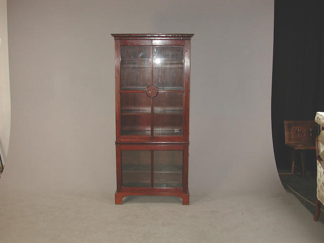 A 19th Century mahogany bookcase, the lower and upper sections with adjustable shelves, one glazed panel lacking, 87 cm wide x 38 cm...