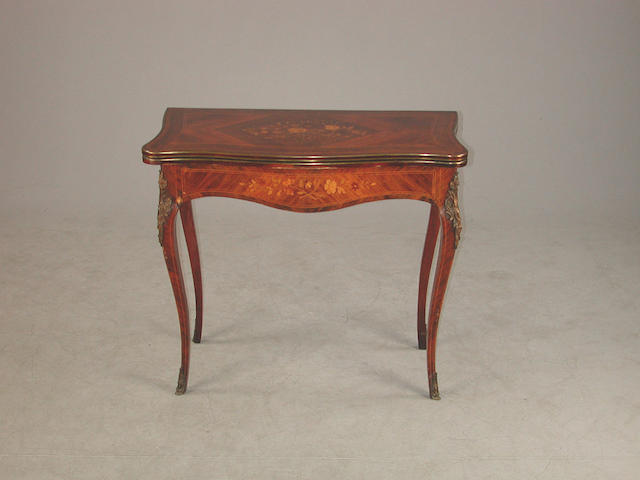 A Late 19th century kingwoodwood and marquetry, rosewood crossbanded card table, with gilt metal mounts and swivel action top, on ca...