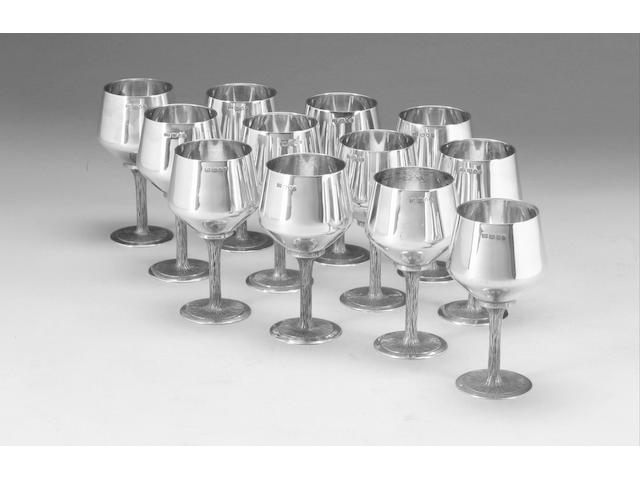 A set of twelve silver goblets, London 1972, and a cased set of six silver goblets, Birmingham 1969, (18)