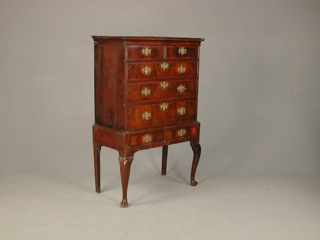A George I walnut chest on stand 101 cm wide x 54 cm deep x 157 cm high later handles