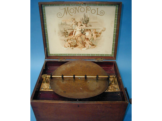 A Monopol disc musical box,