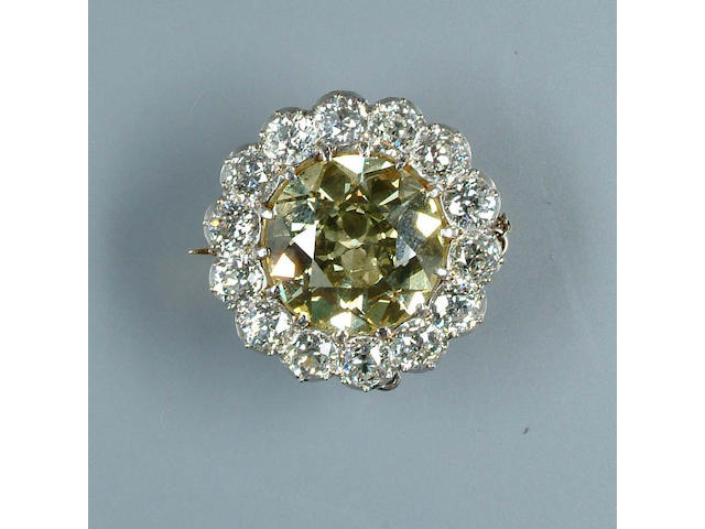 A yellow diamond cluster brooch